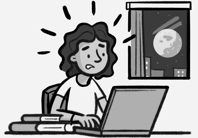 Stressed teacher lesson planning at home on a Sunday night