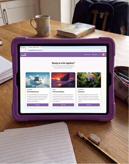 An iPad displaying the Pobble Home writing platform sits on a wooden dining table beside an exercise book, pencil and mug, ready for a child to begin writing. An iPad displaying the Pobble Home writing platform sits on a wooden dining table beside an exercise book, pencil and mug, ready for a child to begin writing.